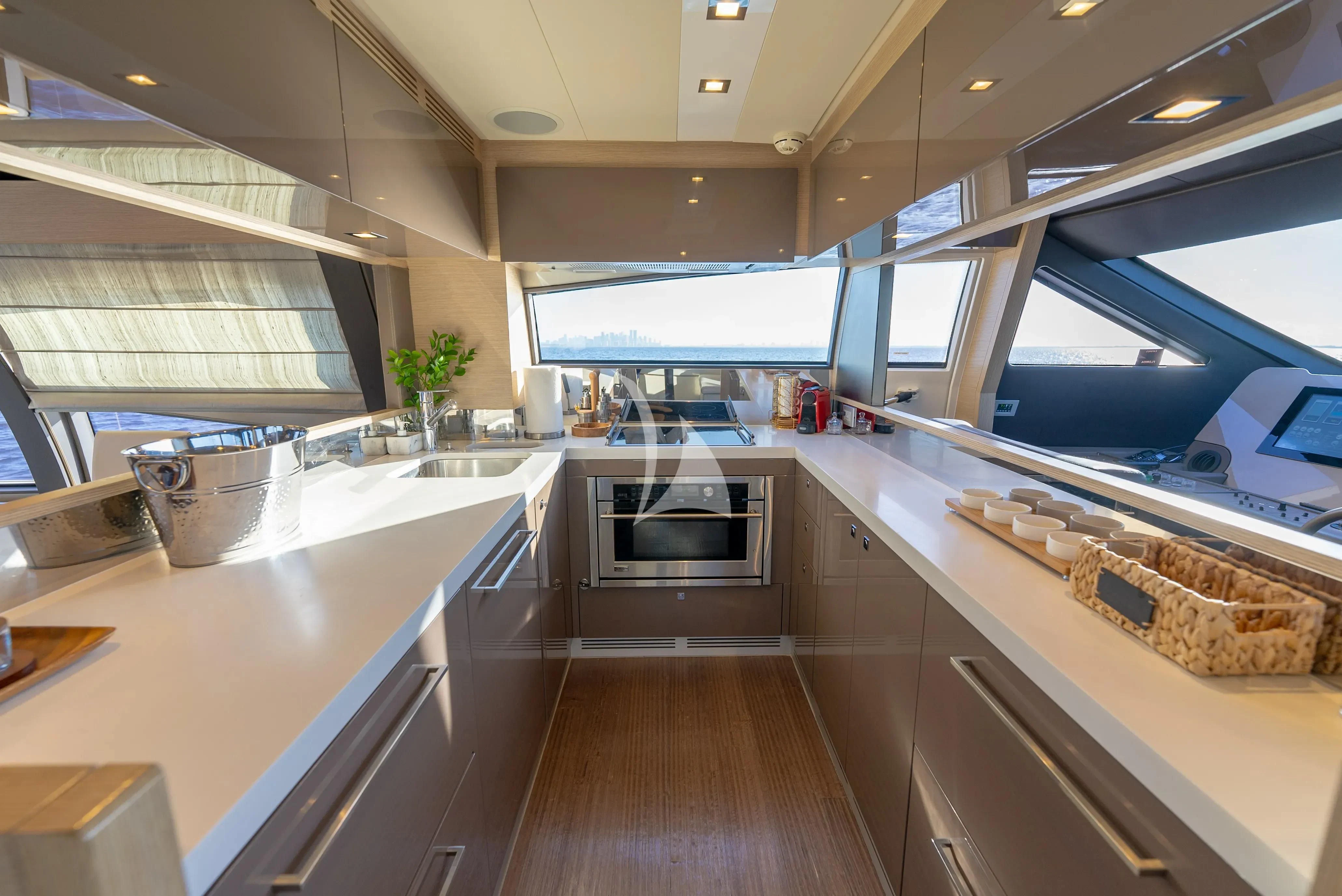 a kitchen with a large window aboard KUDU Yacht for Sale