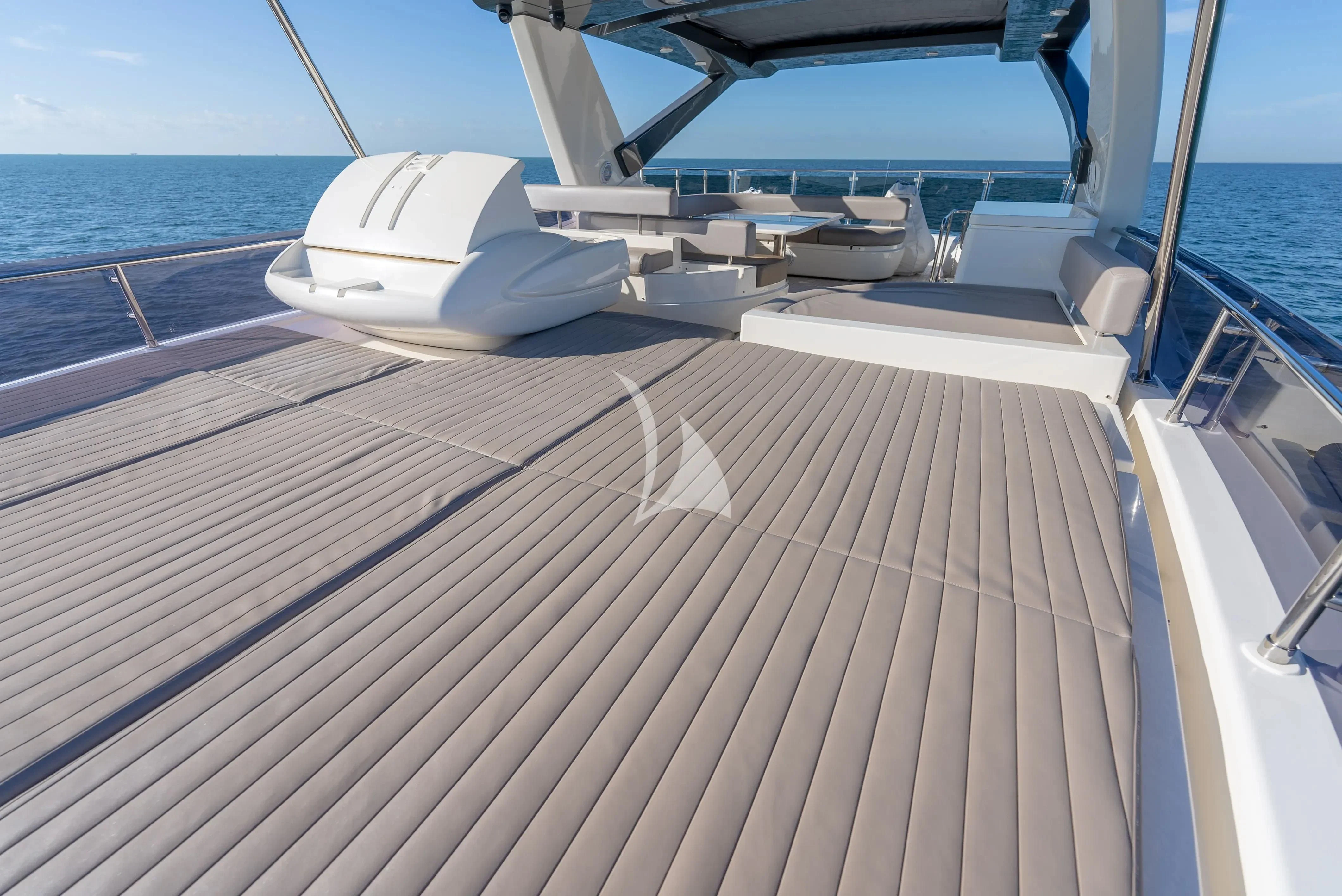 a deck with a boat on it aboard KUDU Yacht for Sale