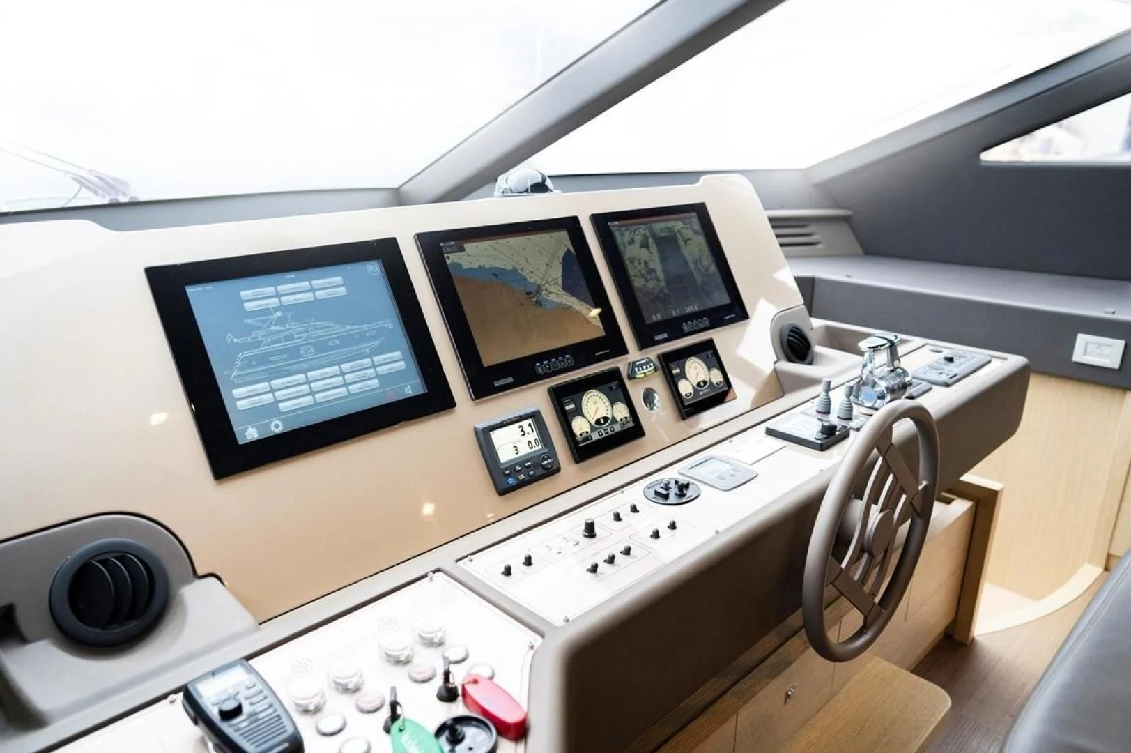 a desk with a computer and a fan aboard KUDU Yacht for Sale