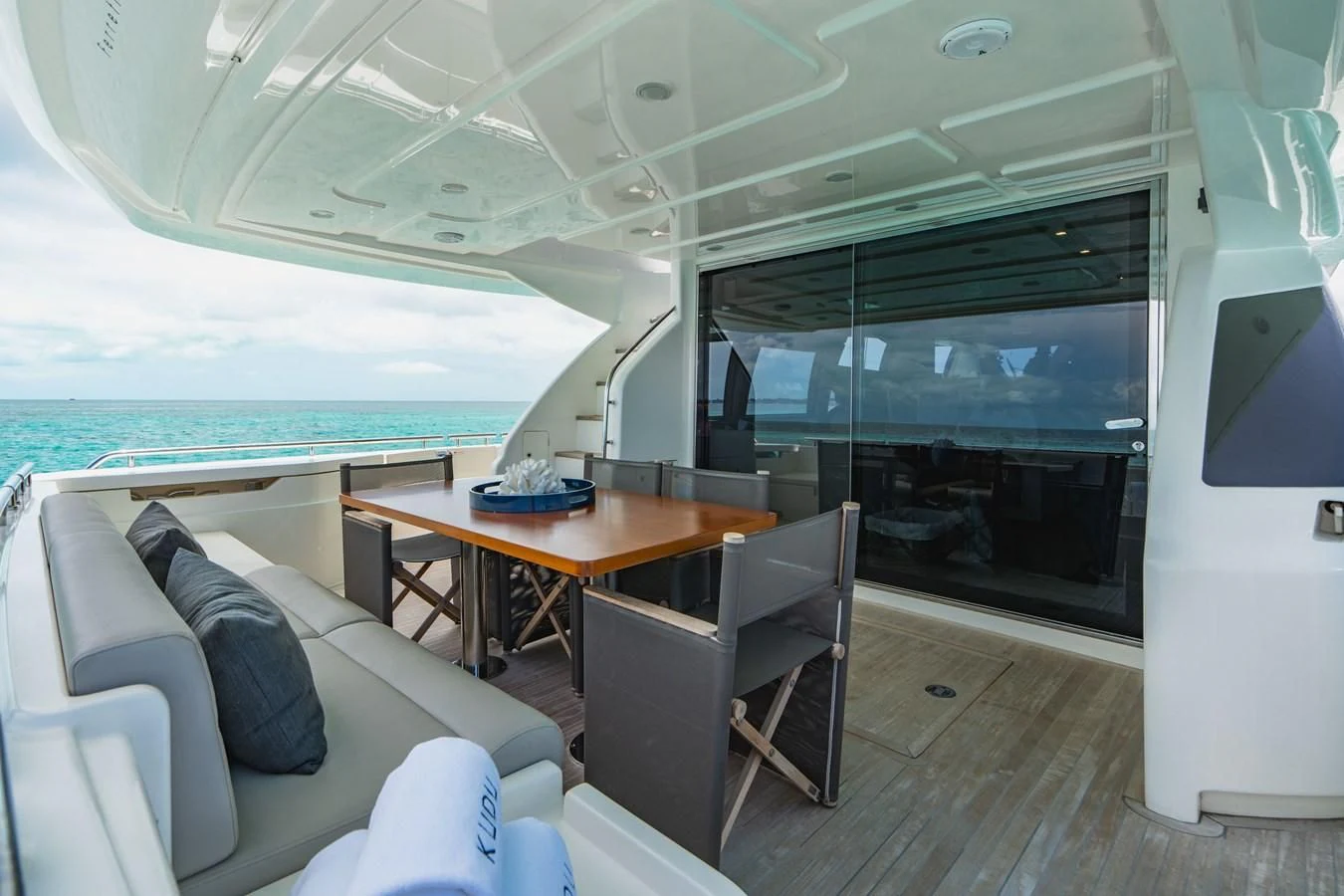 a room with a table and chairs aboard KUDU Yacht for Sale
