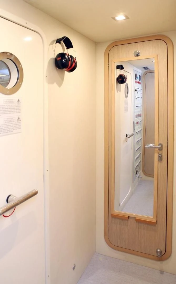 a door with a mirror aboard KUDU Yacht for Sale