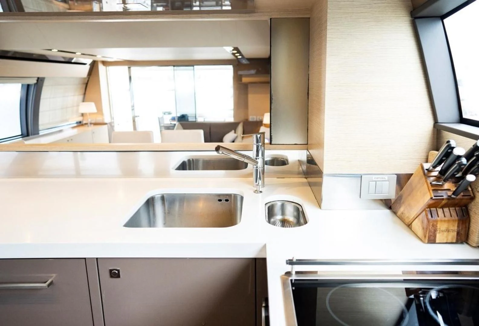 a kitchen with a sink and a mirror aboard KUDU Yacht for Sale