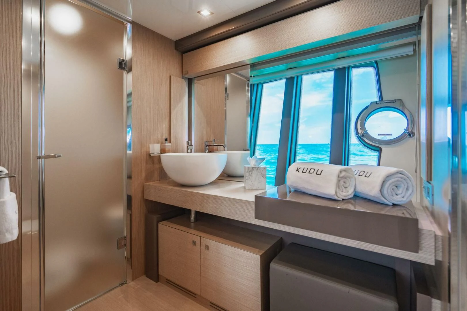 a bathroom with a sink and a mirror aboard KUDU Yacht for Sale