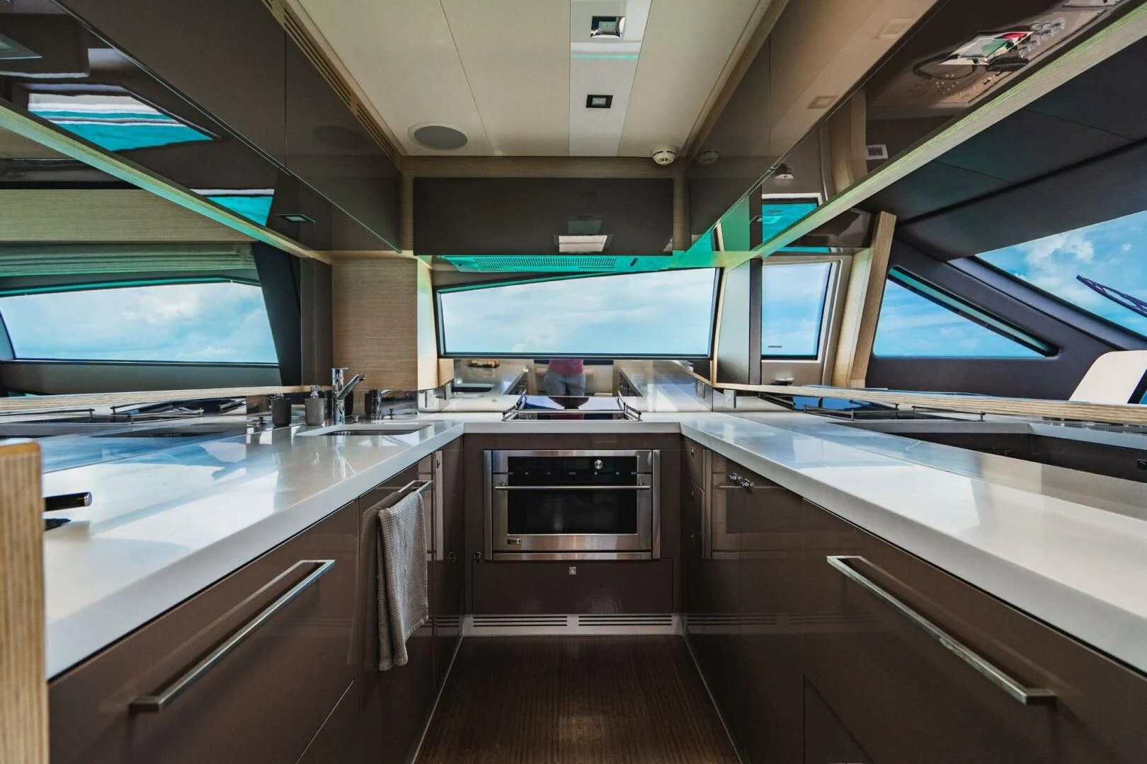 a kitchen with a large window aboard KUDU Yacht for Sale
