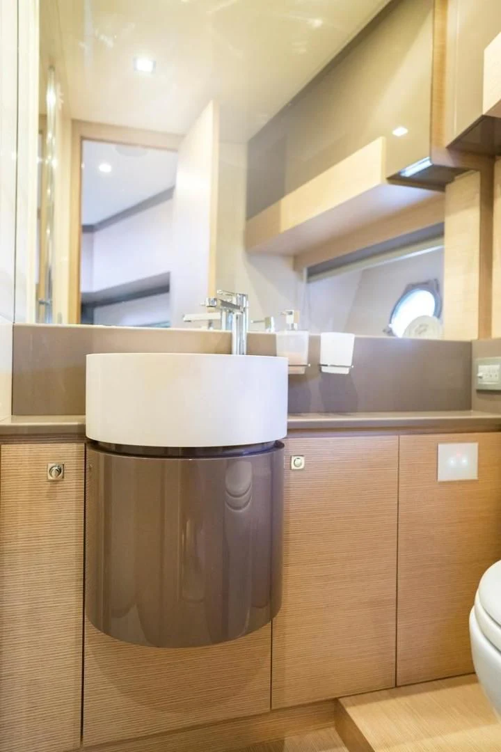 a kitchen with a stainless steel coffee mug aboard KUDU Yacht for Sale