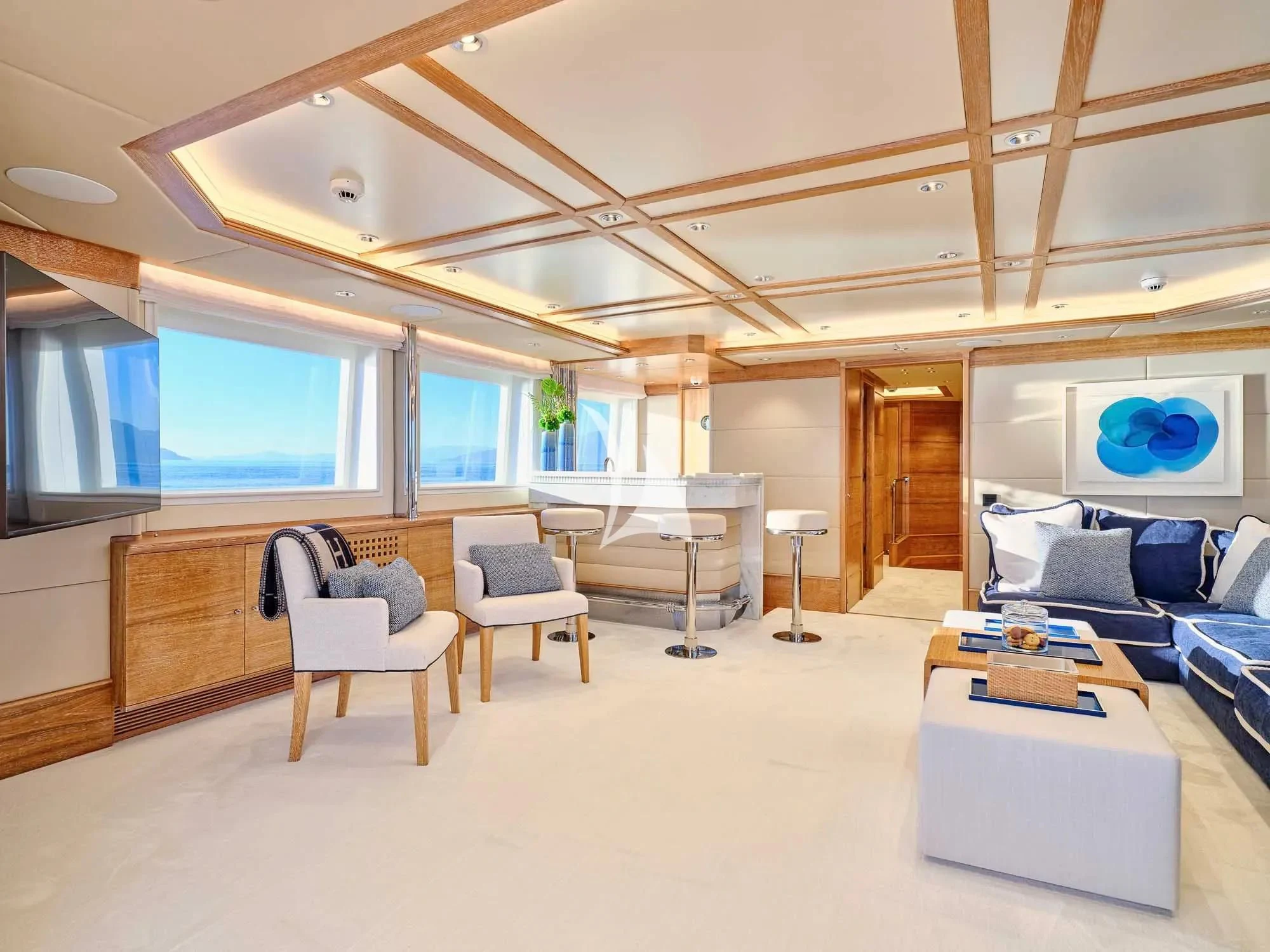 a room with a couch and a table and a chair aboard ARTEMISEA Yacht for Sale