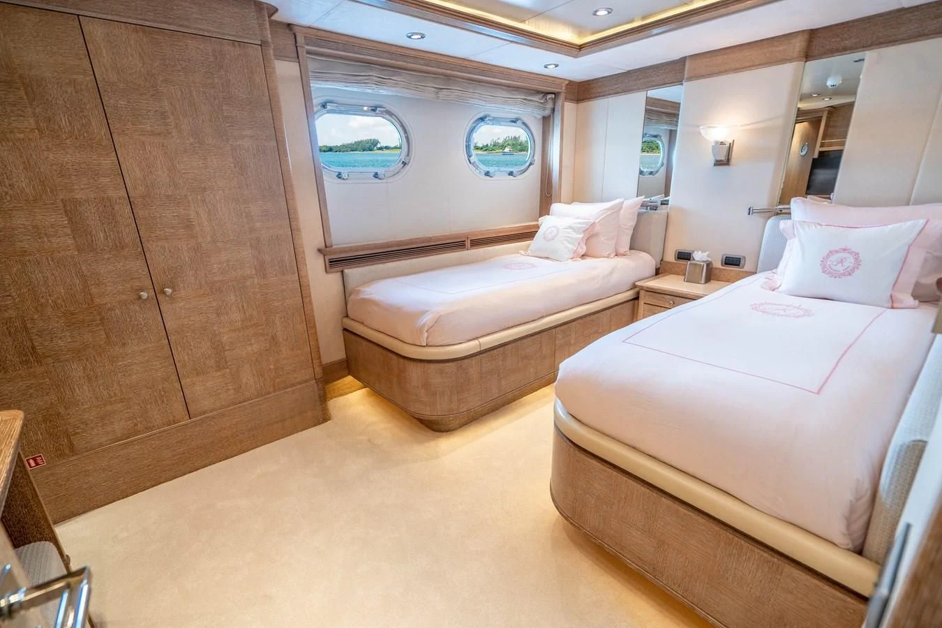a room with a bed and a dresser aboard ARTEMISEA Yacht for Sale