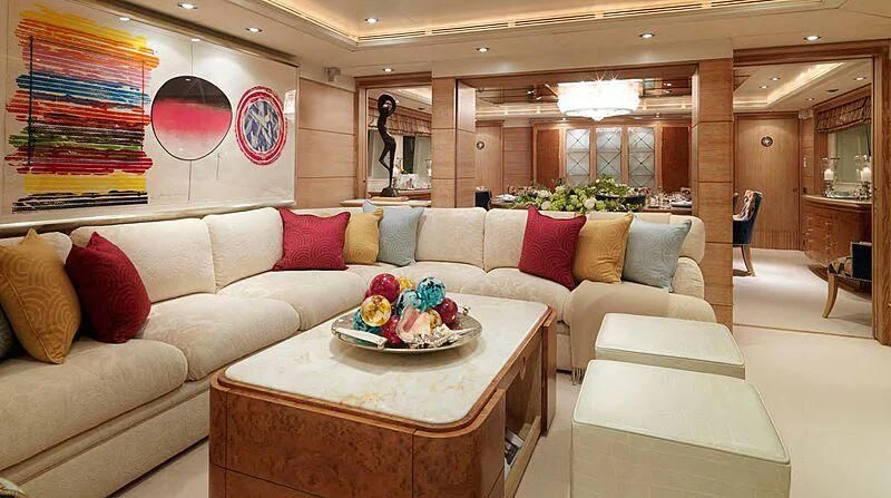 a living room with a couch and a table aboard ARTEMISEA Yacht for Sale