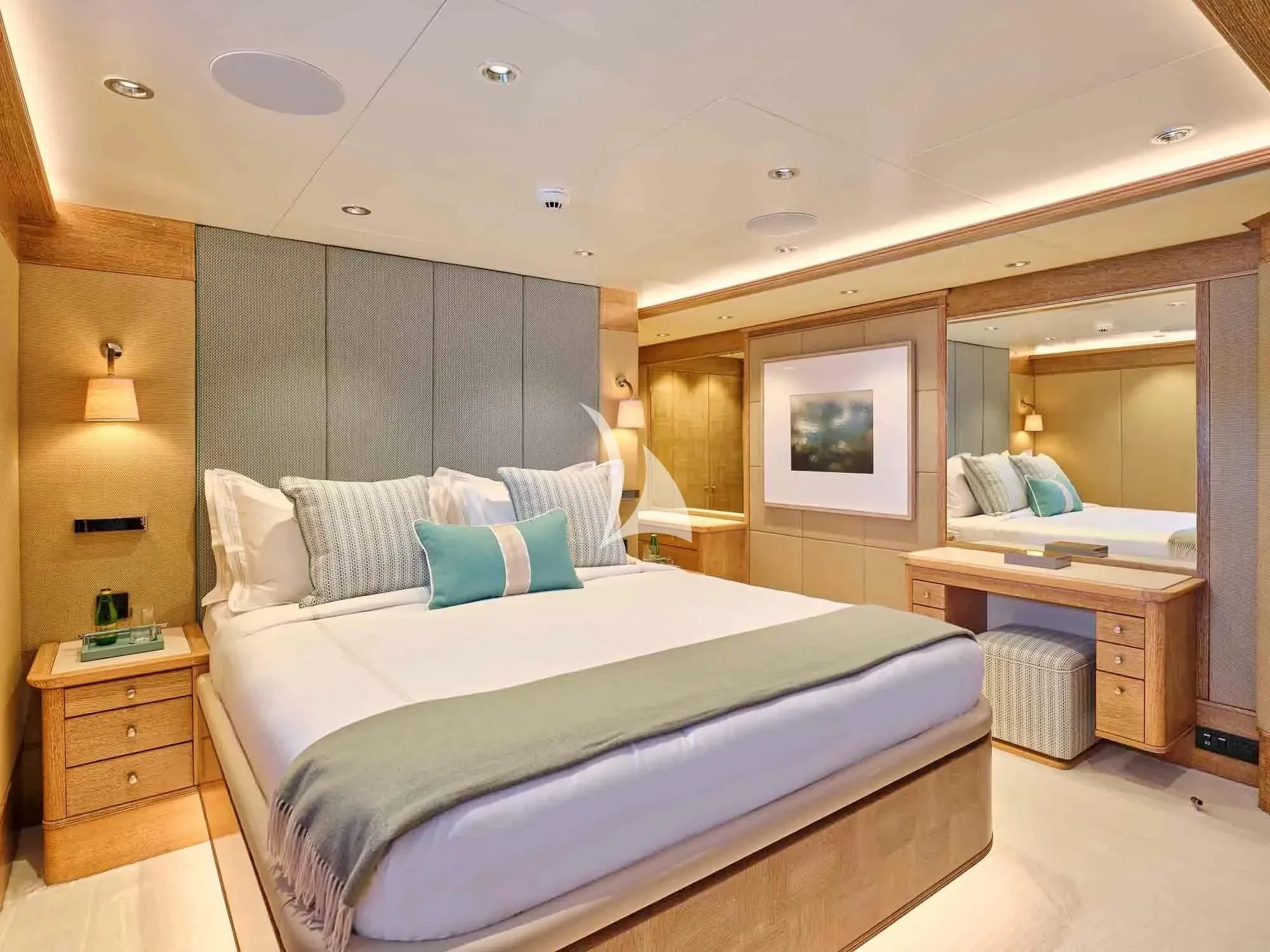 a bedroom with a bed and a desk aboard ARTEMISEA Yacht for Sale