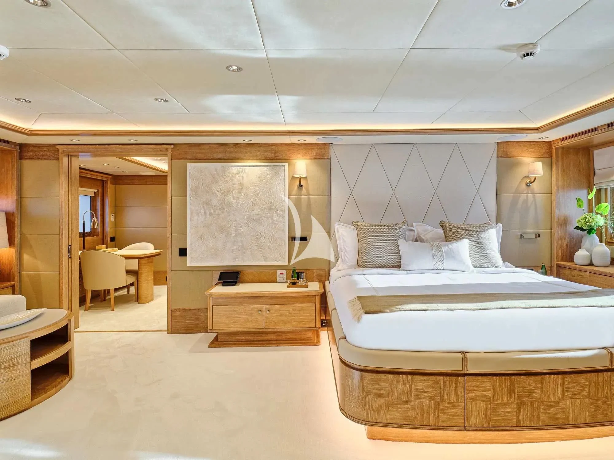 a room with a bed and a chair aboard ARTEMISEA Yacht for Sale