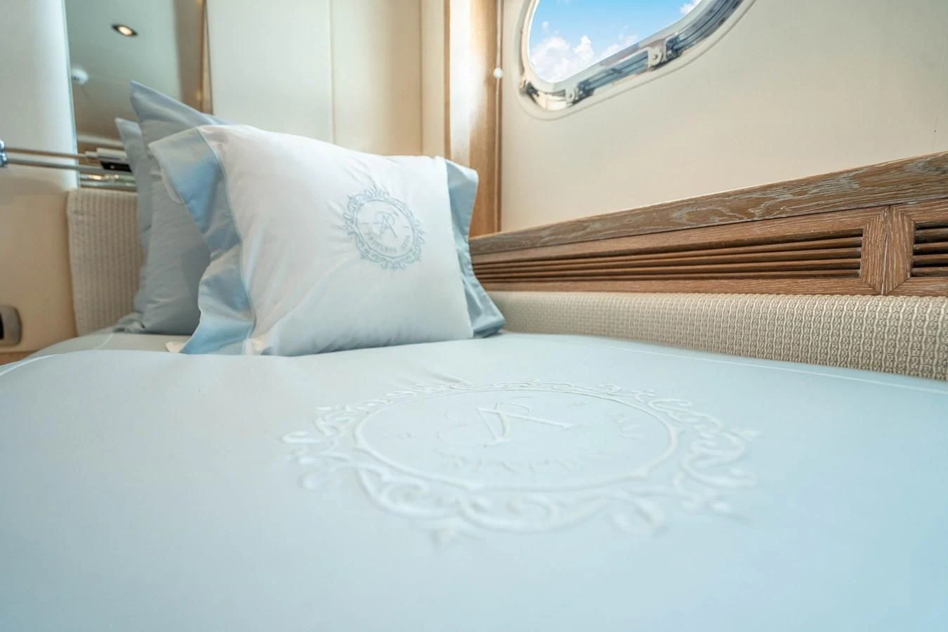 a bed with a white sheet and a pillow on it aboard ARTEMISEA Yacht for Sale