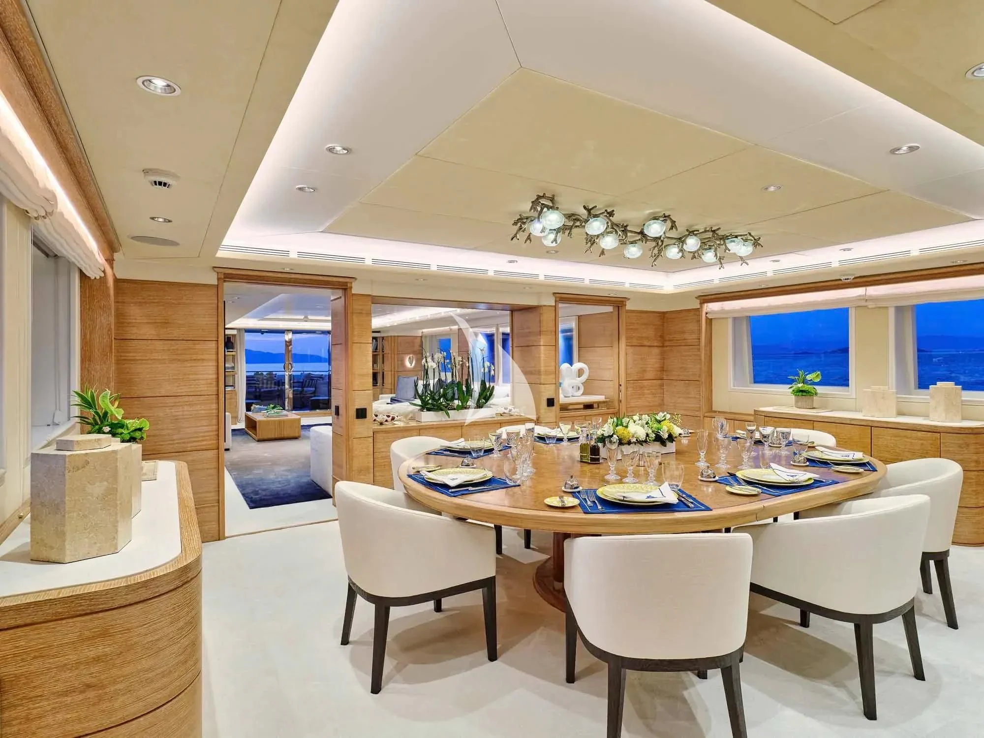 a large dining room with a table and chairs aboard ARTEMISEA Yacht for Sale