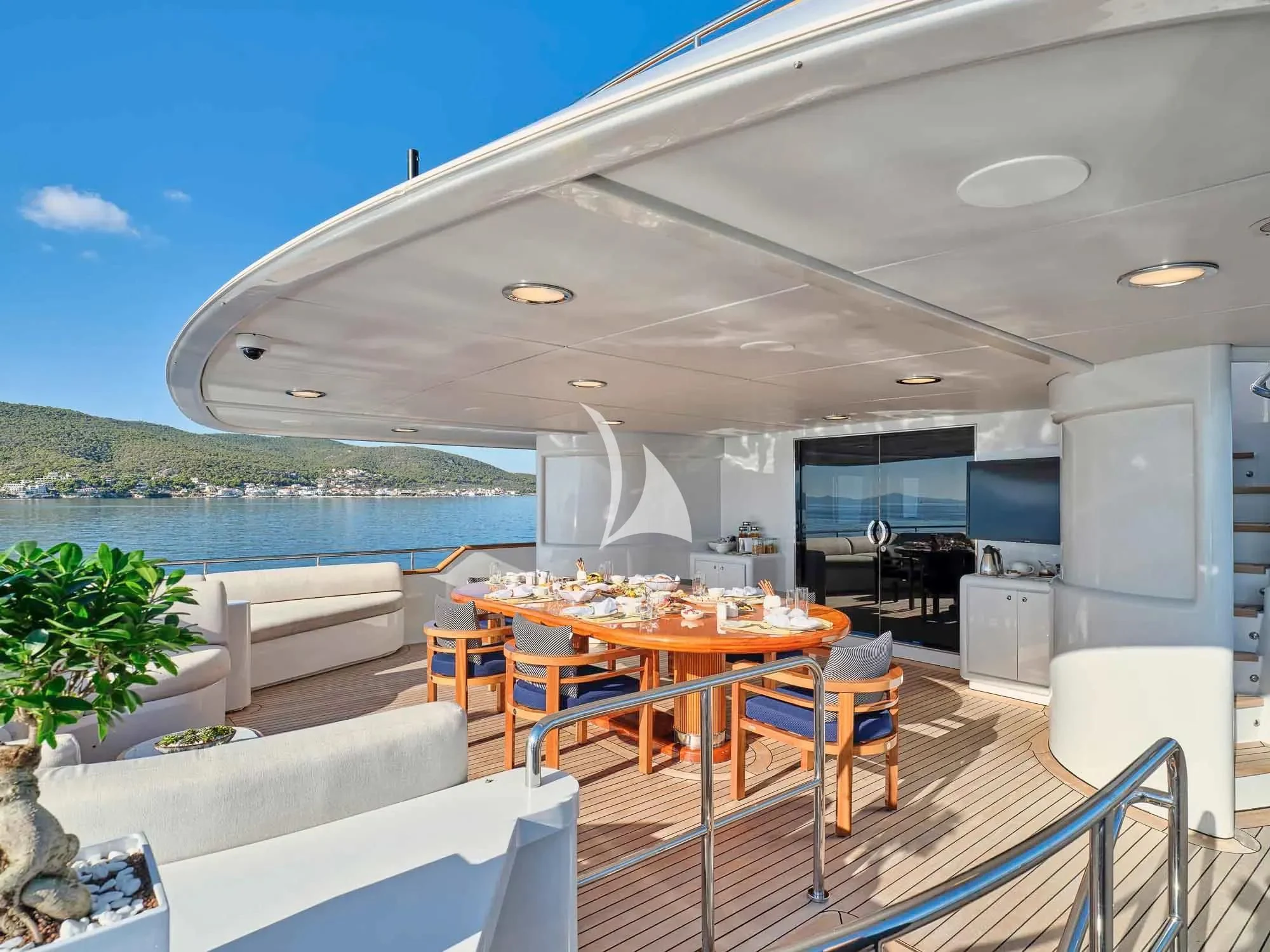 a balcony with a table and chairs aboard ARTEMISEA Yacht for Sale