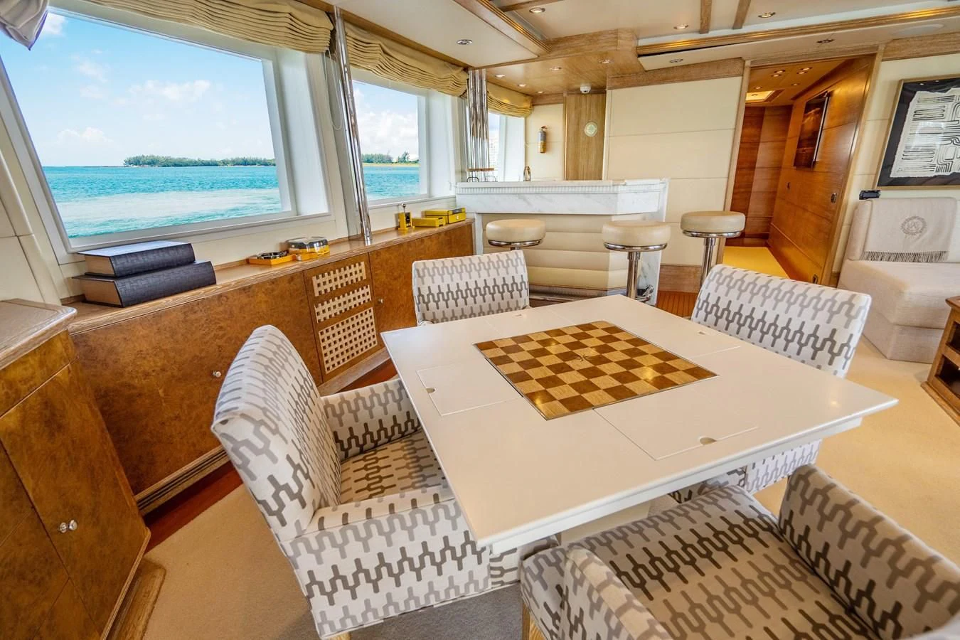 a room with a table and chairs aboard ARTEMISEA Yacht for Sale