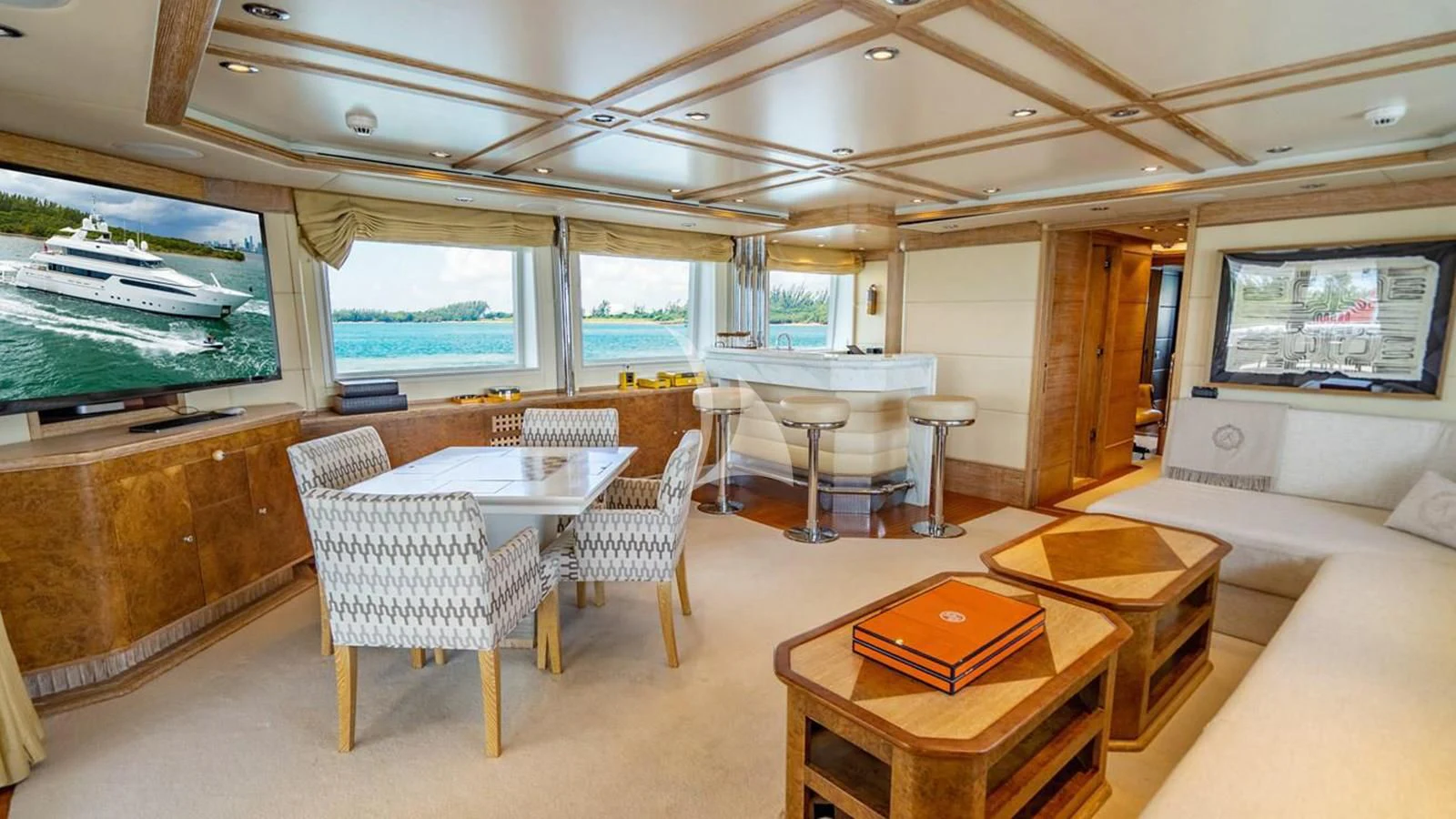 a room with tables and chairs aboard ARTEMISEA Yacht for Sale