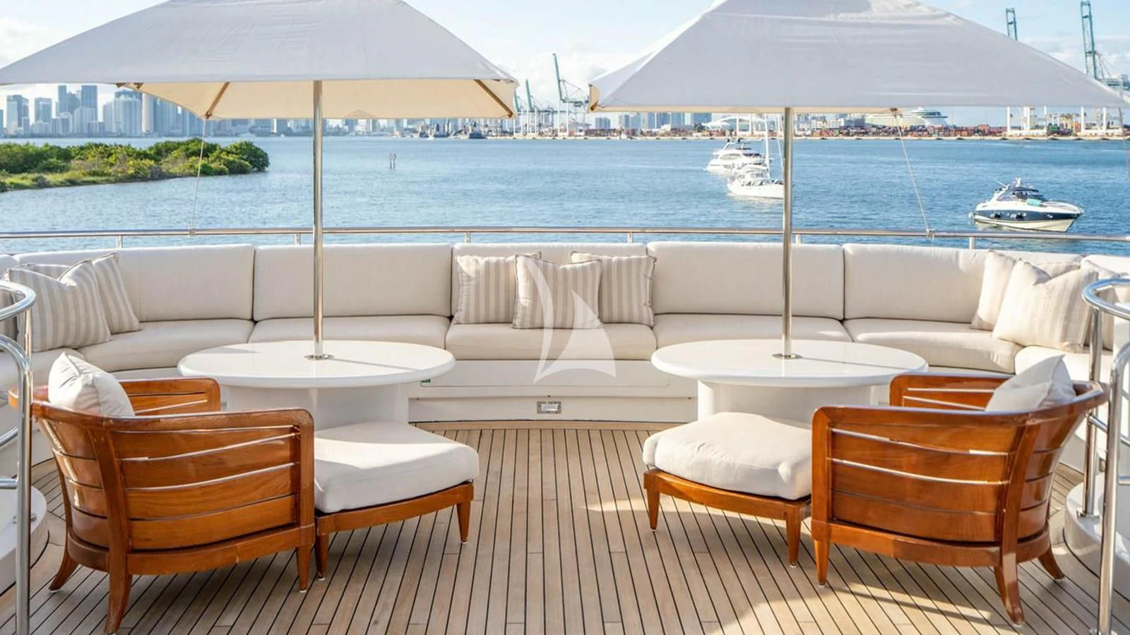 a deck with chairs and umbrellas aboard ARTEMISEA Yacht for Sale