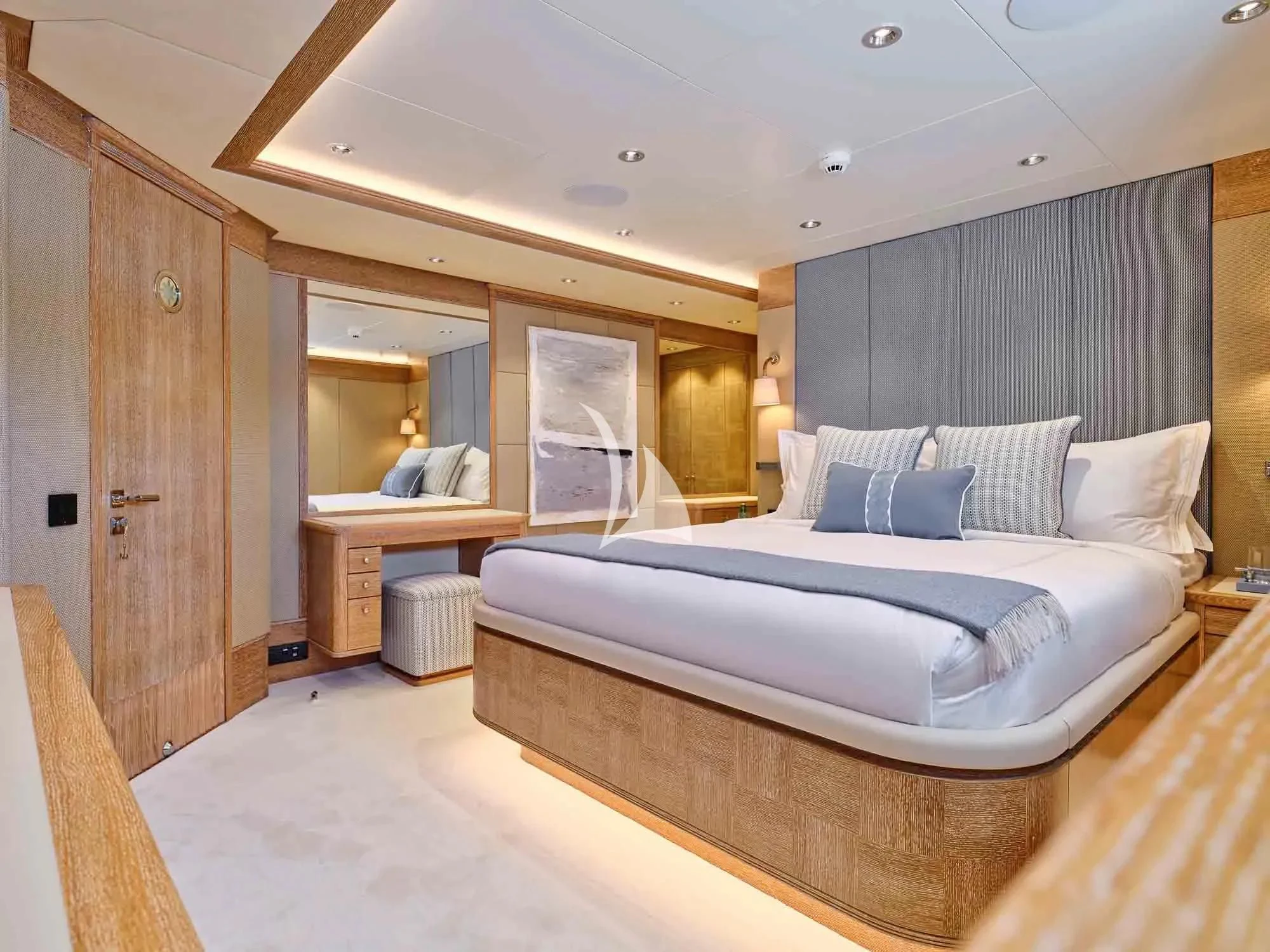 a room with a bed and a desk aboard ARTEMISEA Yacht for Sale