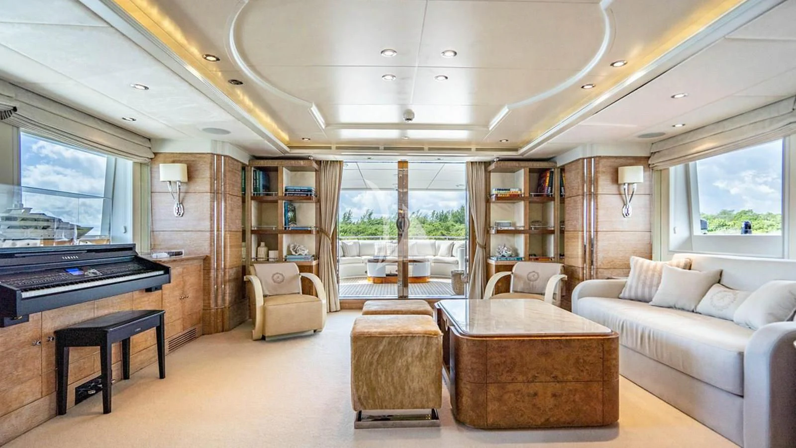 a living room with a piano and a piano aboard ARTEMISEA Yacht for Sale