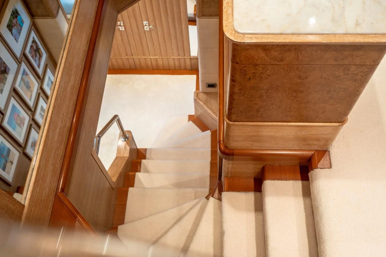 a staircase with a wood railing aboard ARTEMISEA Yacht for Sale
