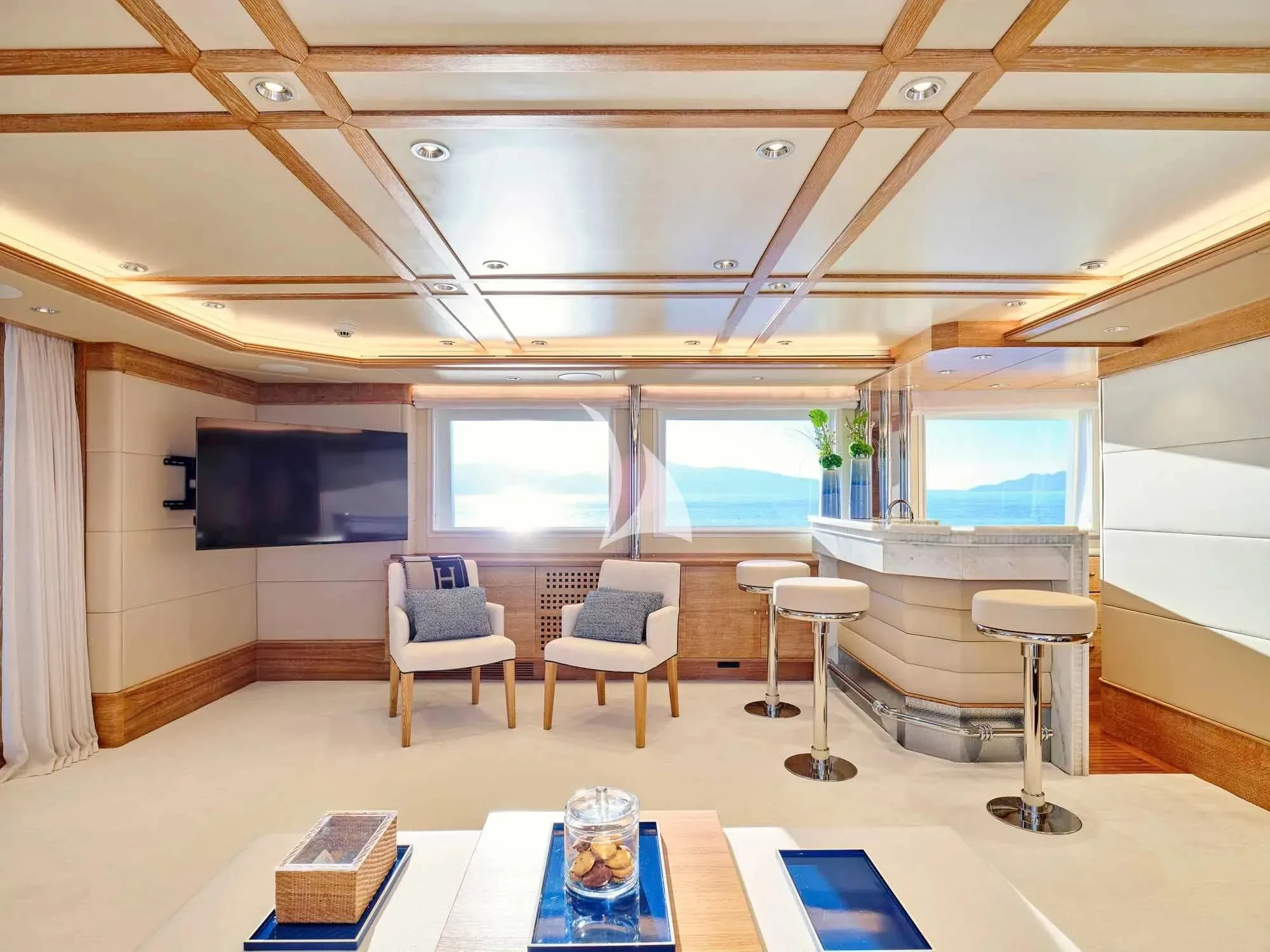 a room with tables and chairs aboard ARTEMISEA Yacht for Sale