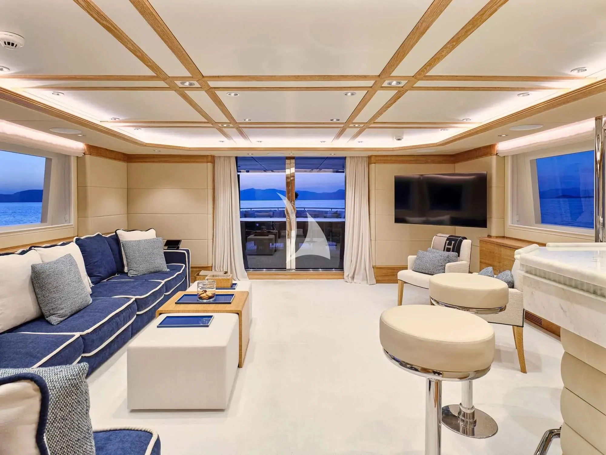 a room with a couch and a tv aboard ARTEMISEA Yacht for Sale