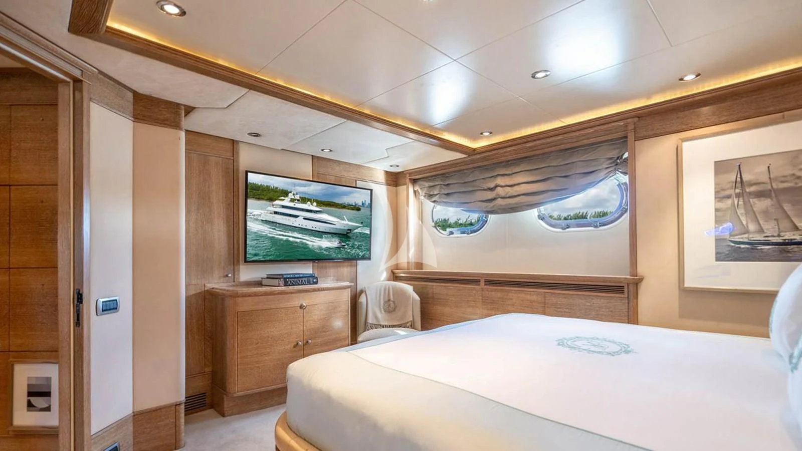 a room with a bed and a television aboard ARTEMISEA Yacht for Sale