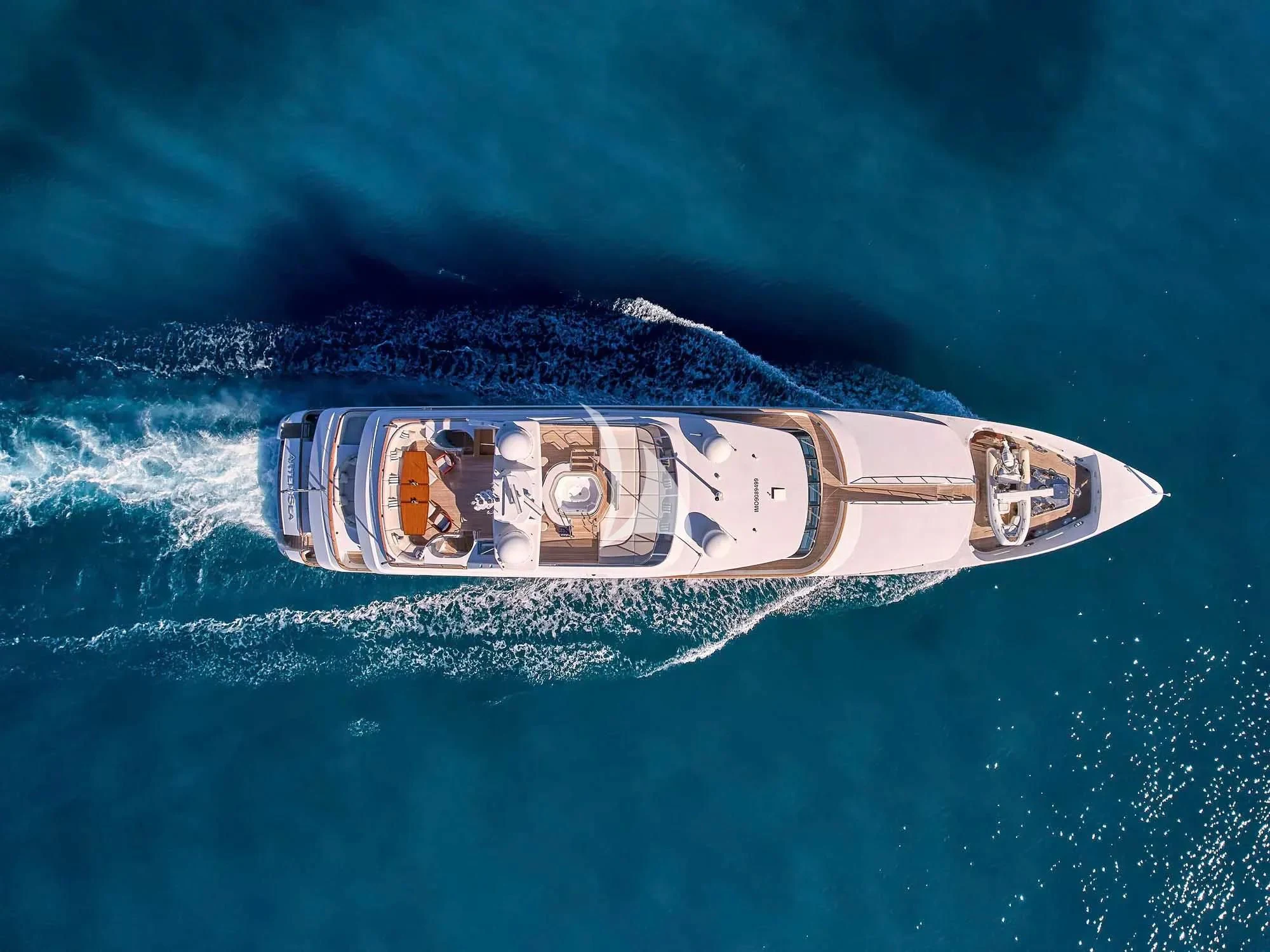 a small metal ship in the water aboard ARTEMISEA Yacht for Sale