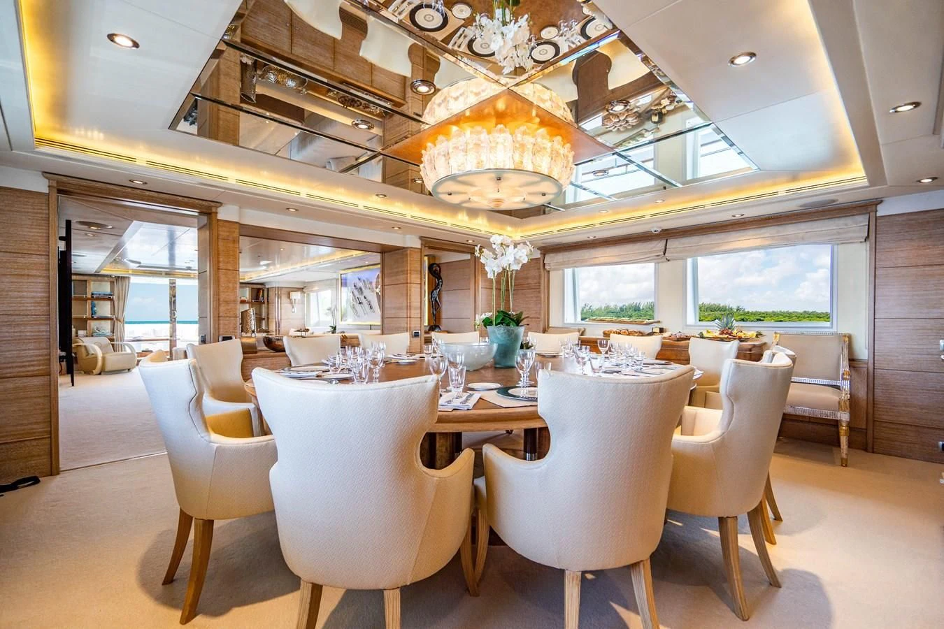 a dining room with a chandelier aboard ARTEMISEA Yacht for Sale