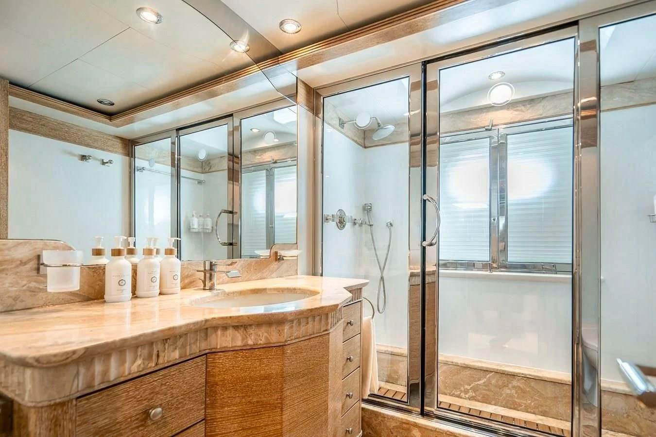 a bathroom with a large glass shower aboard ARTEMISEA Yacht for Sale