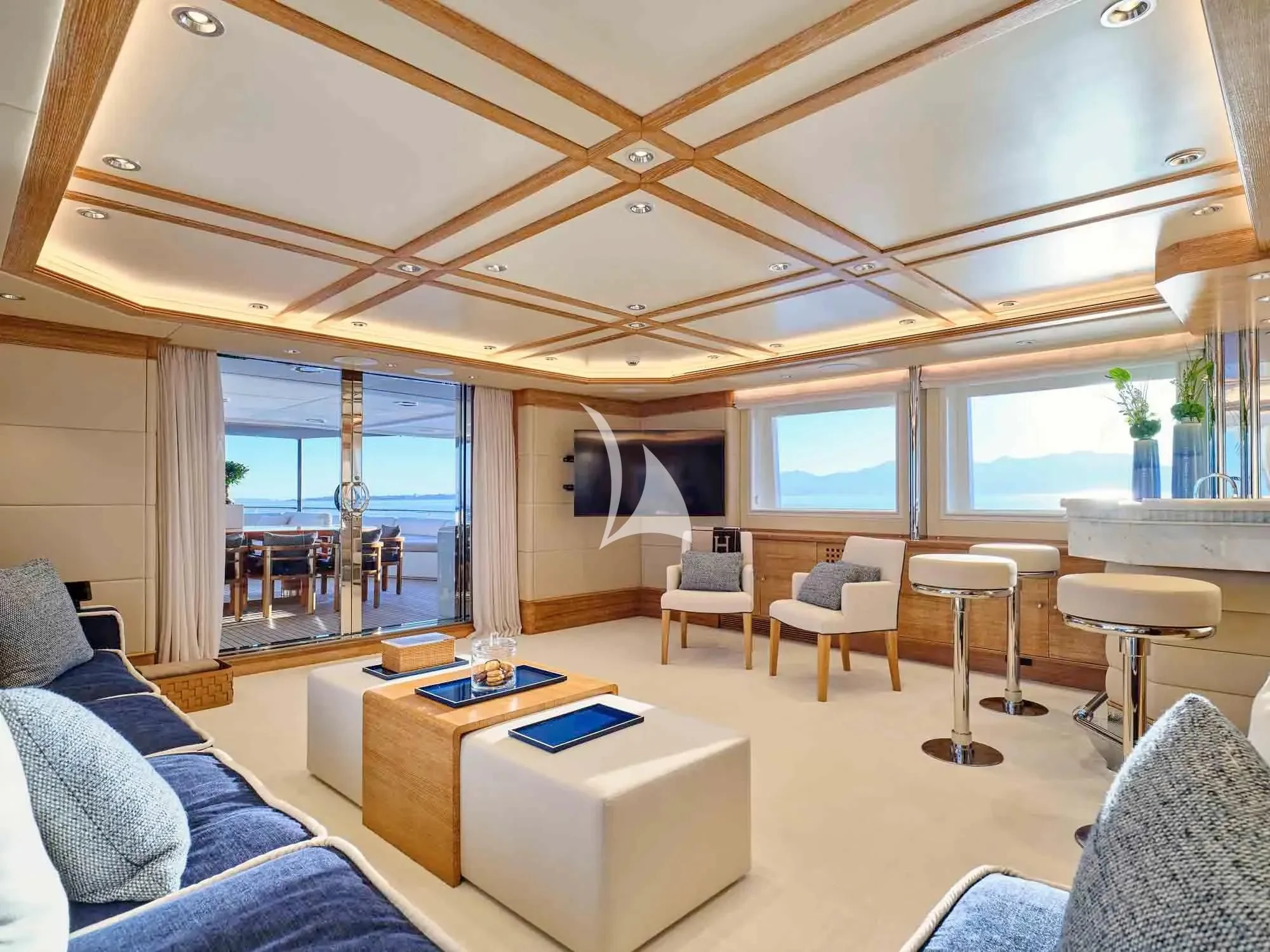 a room with a couch and a table and a window aboard ARTEMISEA Yacht for Sale