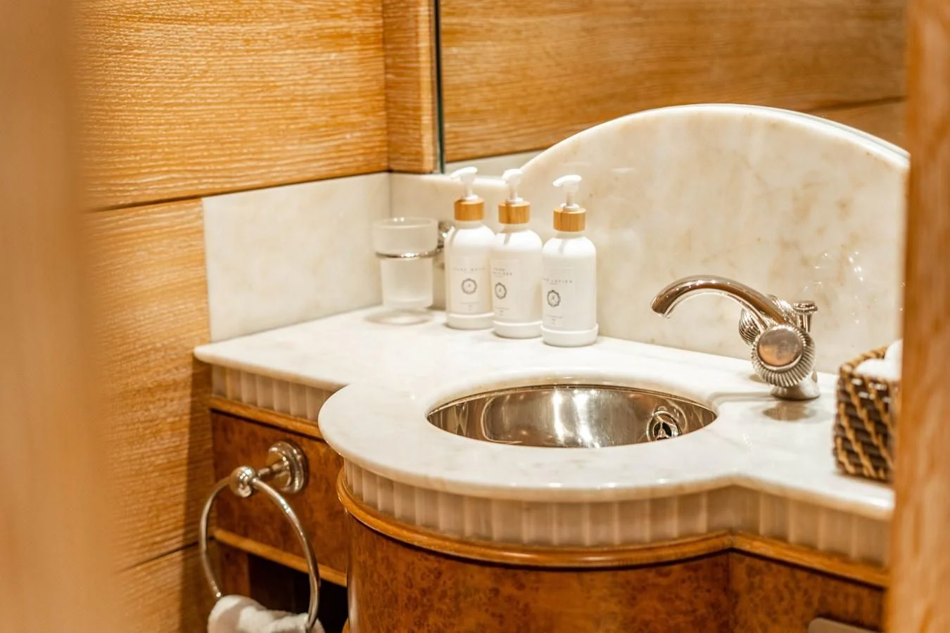 a bathroom sink with a faucet and a mirror aboard ARTEMISEA Yacht for Sale