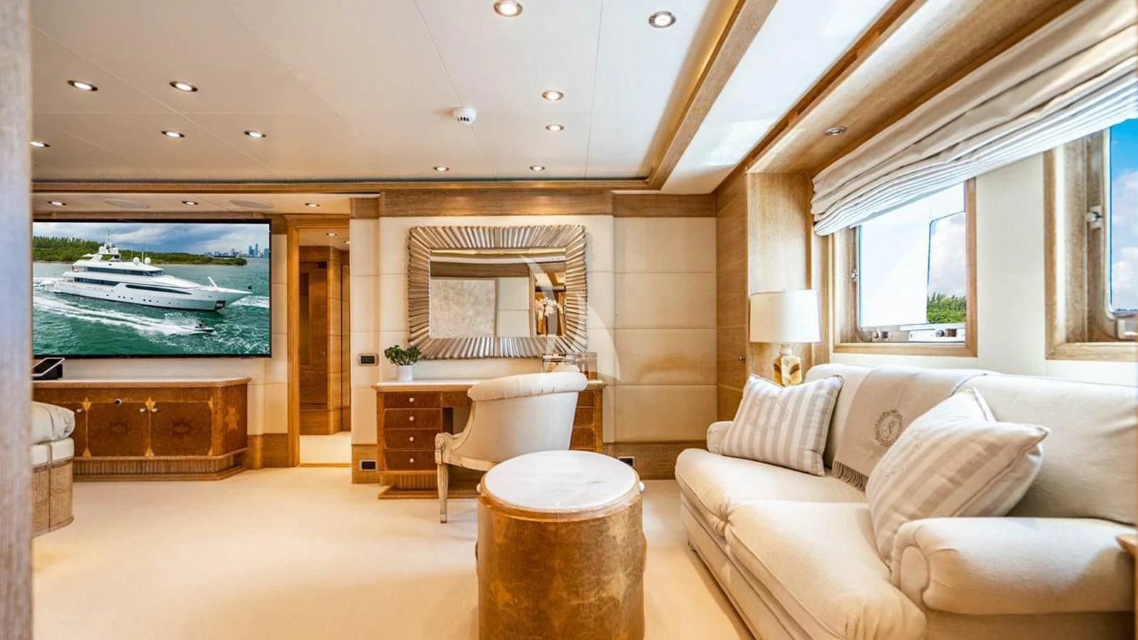a living room with a large screen aboard ARTEMISEA Yacht for Sale
