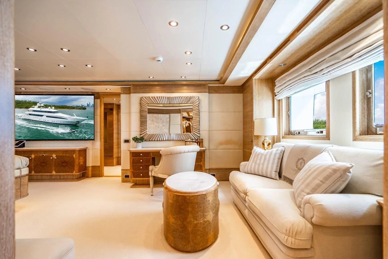a living room with a large television aboard ARTEMISEA Yacht for Sale