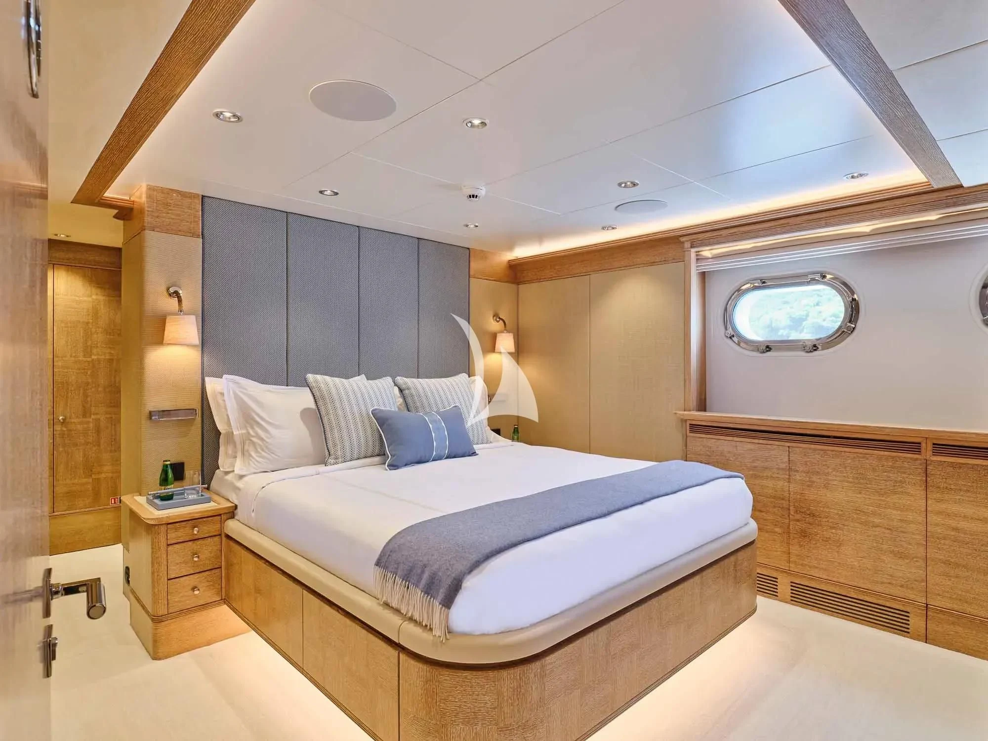 a room with a bed and a mirror aboard ARTEMISEA Yacht for Sale