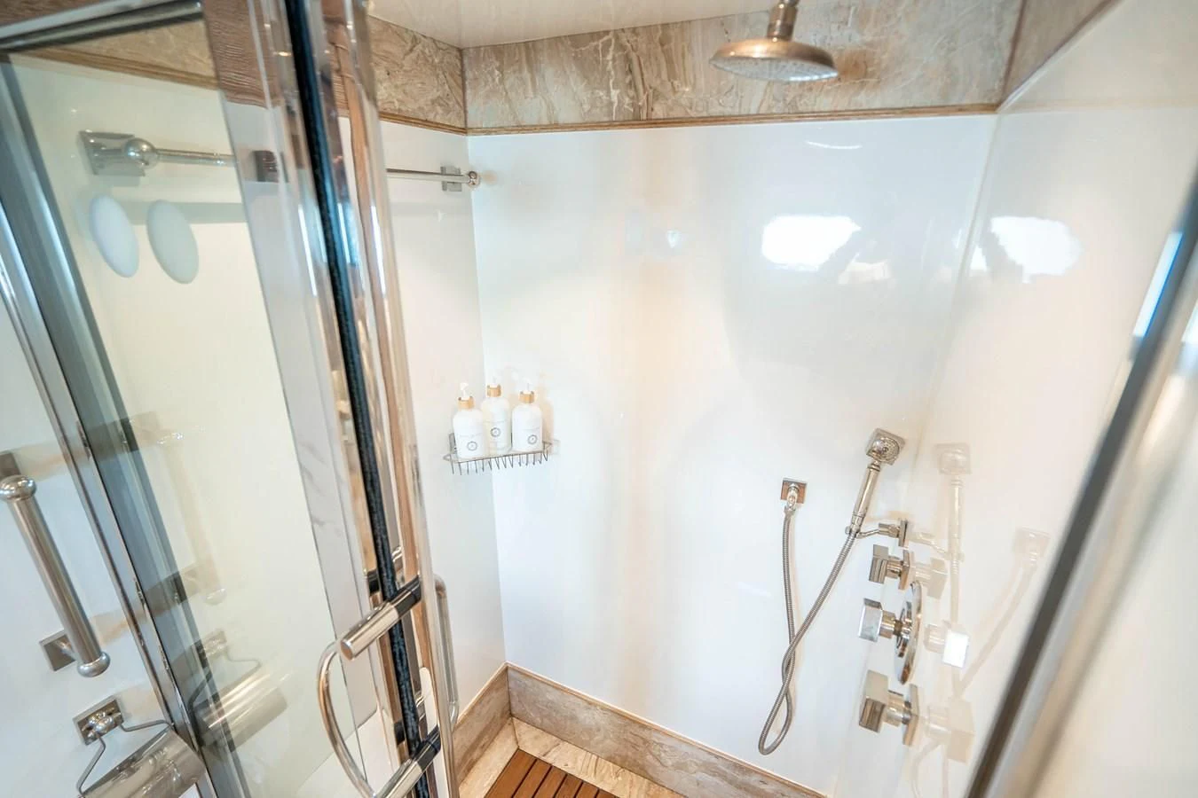a bathroom with a glass shower aboard ARTEMISEA Yacht for Sale