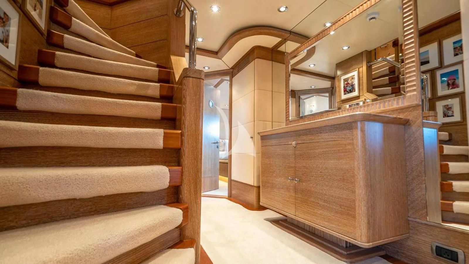 a room with wooden stairs aboard ARTEMISEA Yacht for Sale