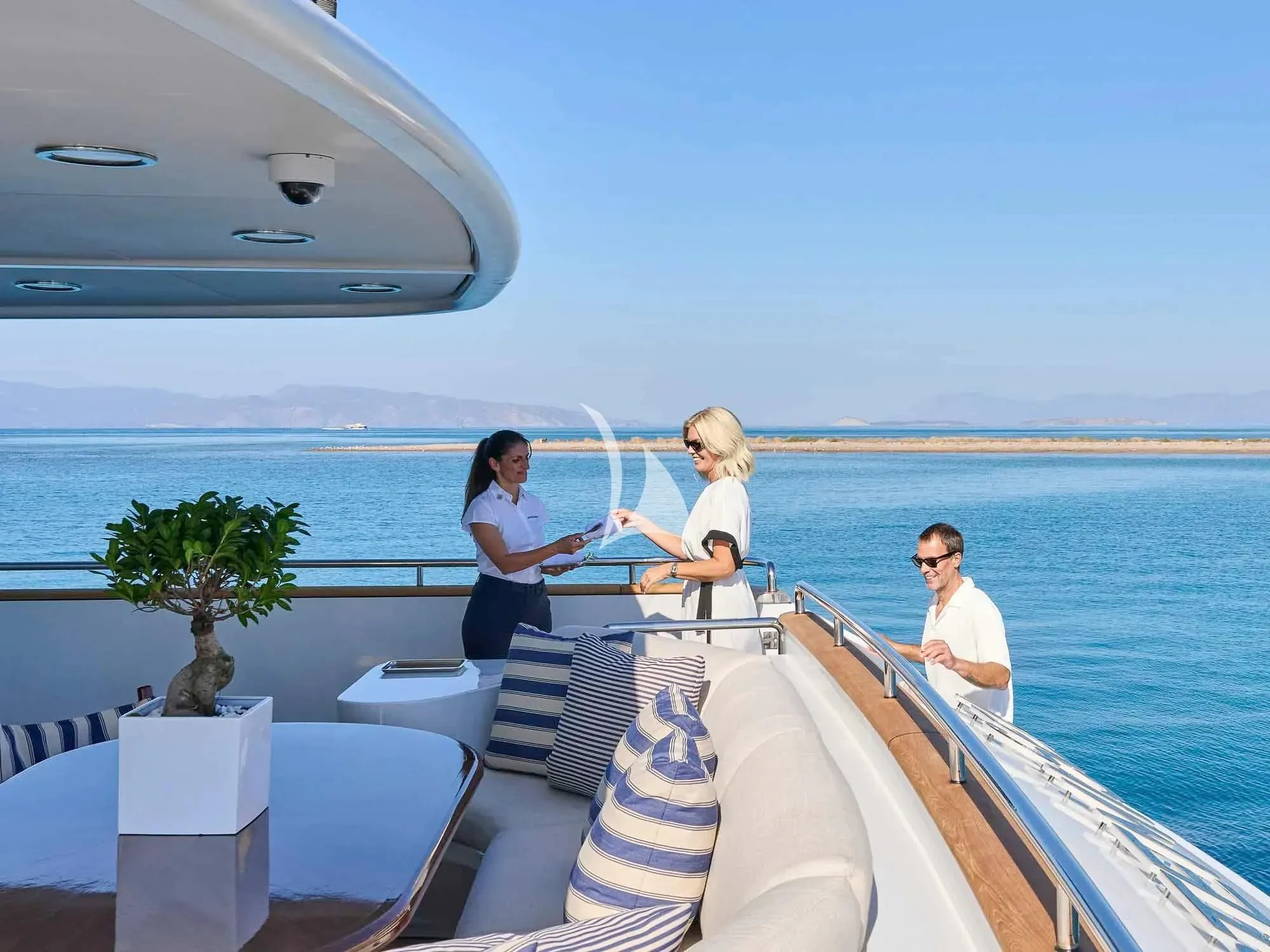 a group of people sitting on a boat aboard ARTEMISEA Yacht for Sale