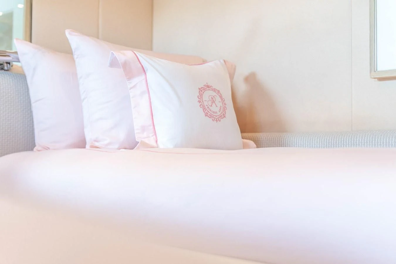 a bed with white sheets and pillows aboard ARTEMISEA Yacht for Sale
