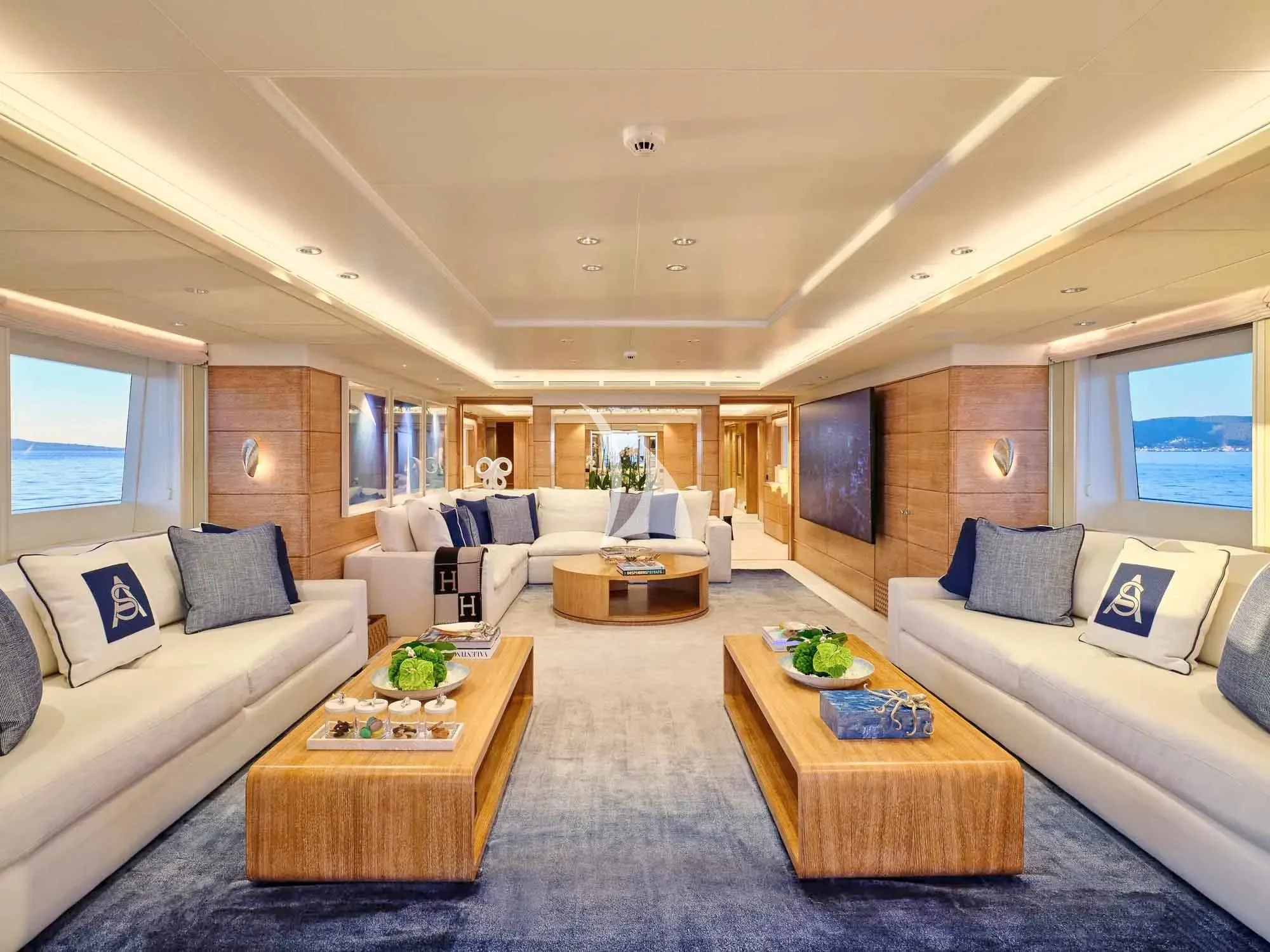 a living room with a couch and a coffee table aboard ARTEMISEA Yacht for Sale