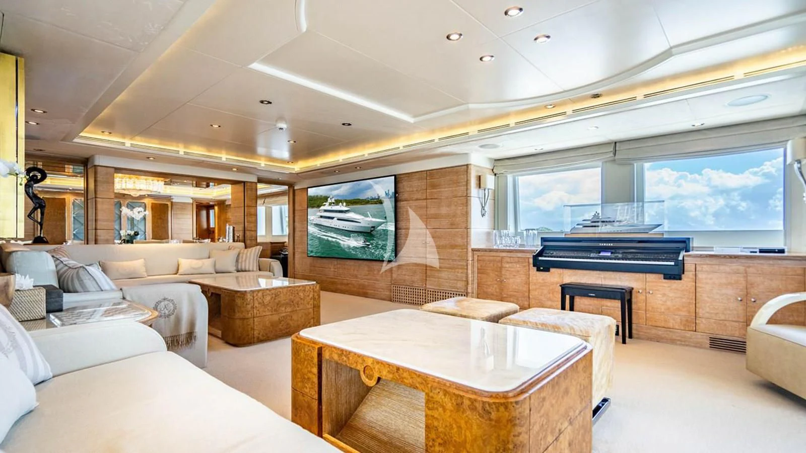 a room with a table and couches aboard ARTEMISEA Yacht for Sale