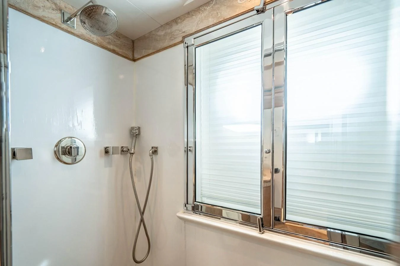 a window with a light fixture aboard ARTEMISEA Yacht for Sale