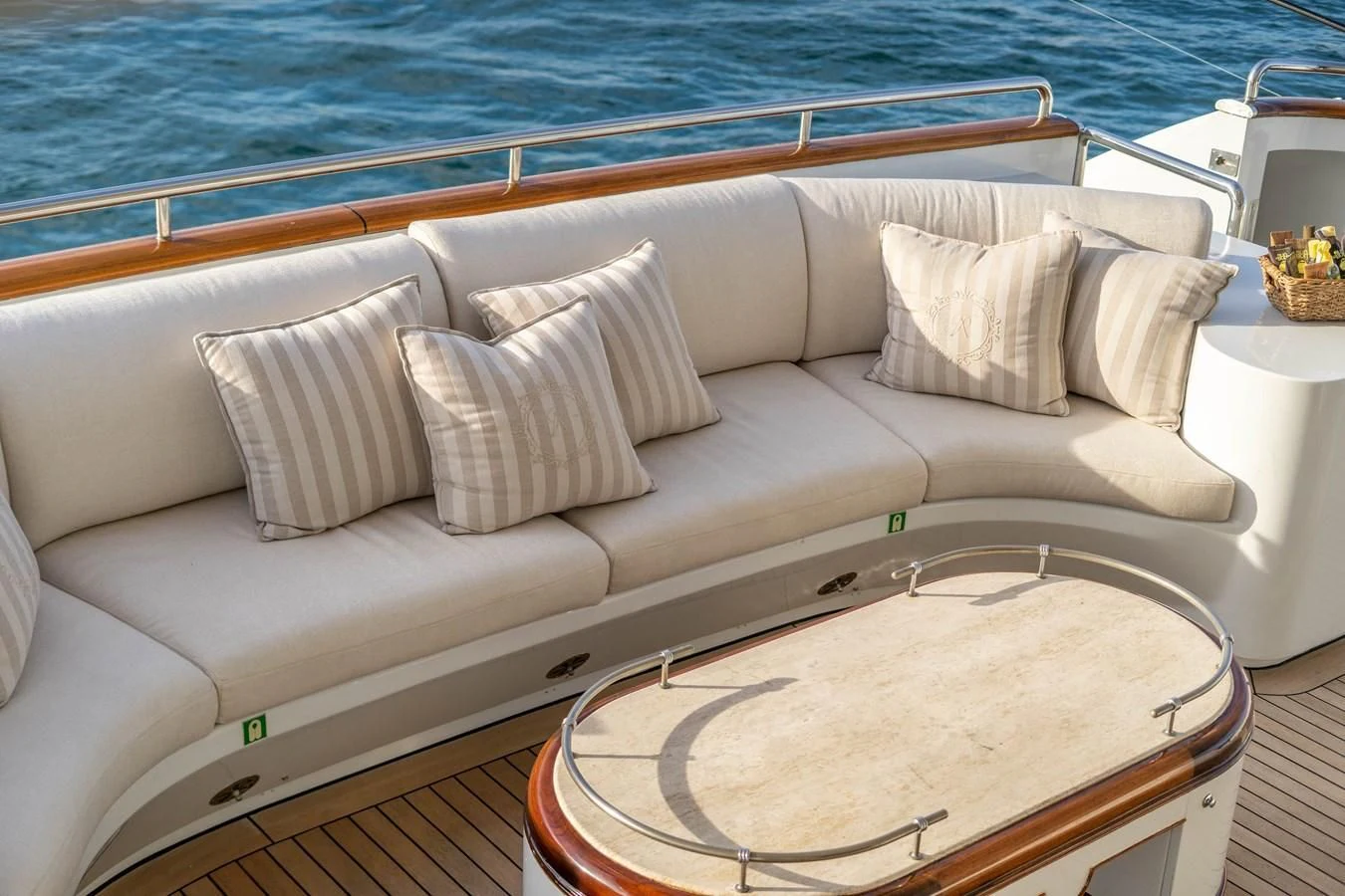 a couch with pillows on it aboard ARTEMISEA Yacht for Sale