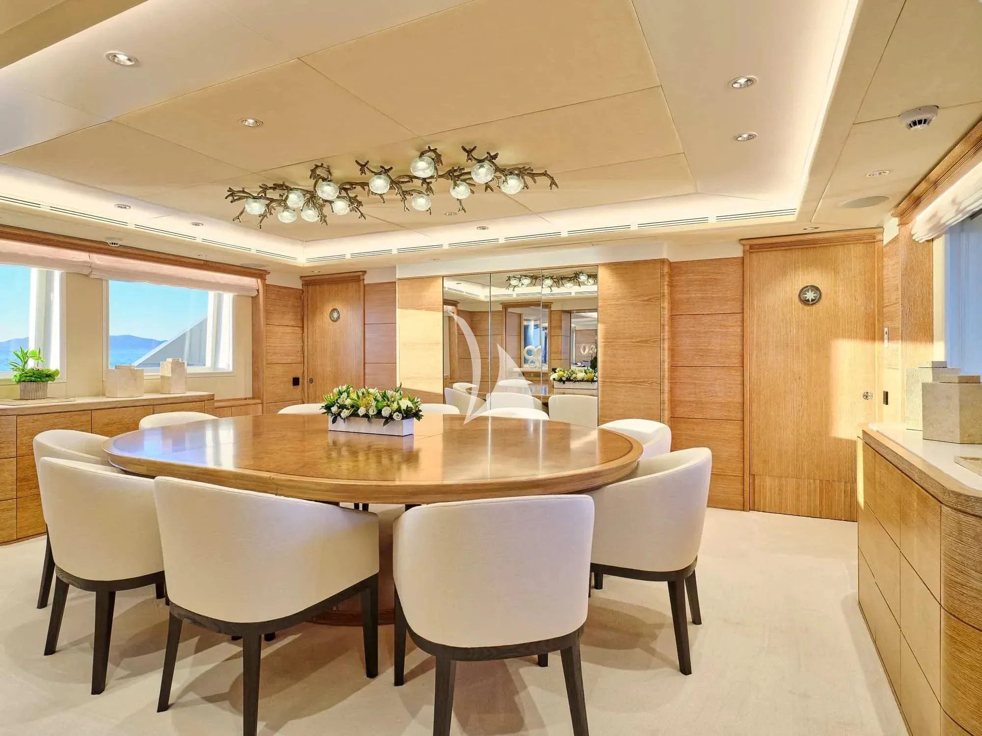 a large kitchen with a table and chairs aboard ARTEMISEA Yacht for Sale