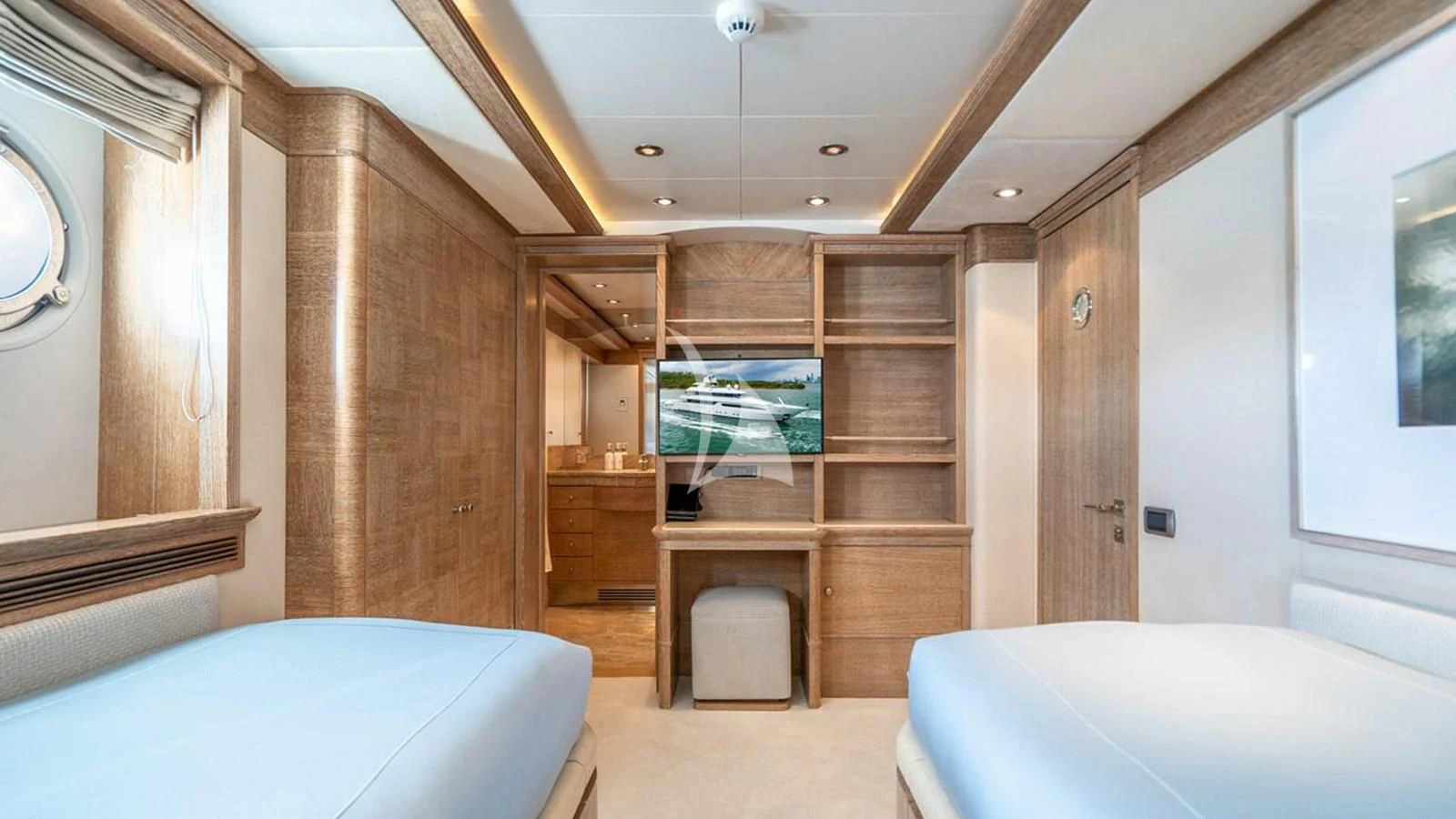 a room with a bed and a desk aboard ARTEMISEA Yacht for Sale