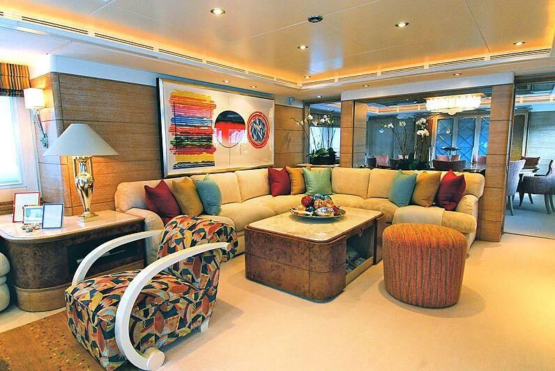 a living room with a couch and a coffee table aboard ARTEMISEA Yacht for Sale