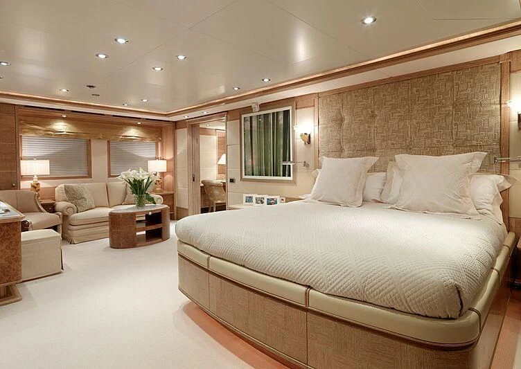 a large bed in a room aboard ARTEMISEA Yacht for Sale