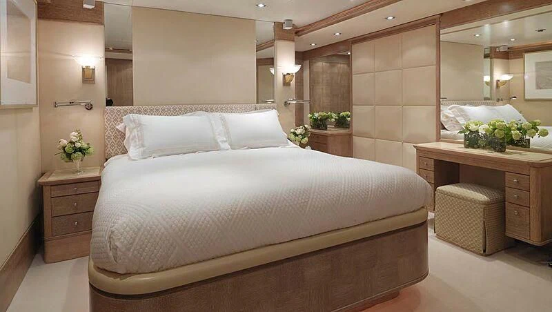 a large bed in a room aboard ARTEMISEA Yacht for Sale