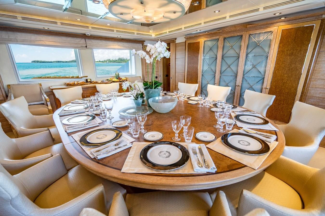 a dining room with a table set aboard ARTEMISEA Yacht for Sale