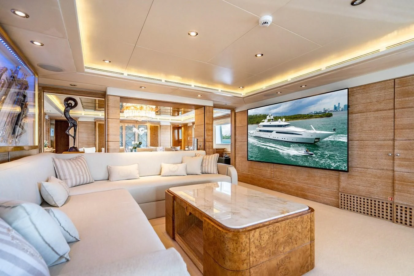 a living room with a large screen aboard ARTEMISEA Yacht for Sale