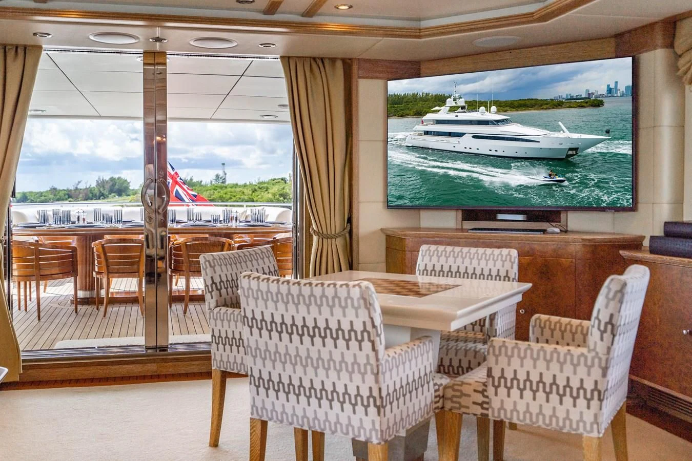 a room with chairs and a table aboard ARTEMISEA Yacht for Sale